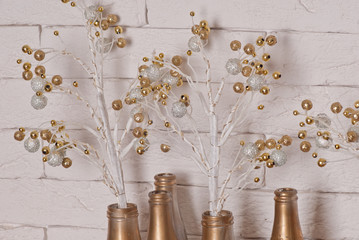 Christmas decoration with golden balls and bottles 