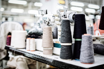 Wool and thread spools on desk