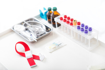 Test-tubes and medical tools on table