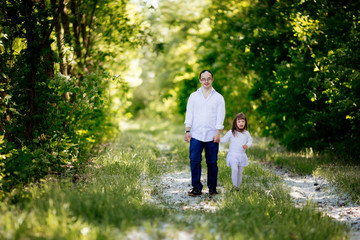 Fototapeta premium People with down sydrome walking in forest