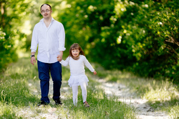 Fototapeta premium People with down sydrome walking in forest