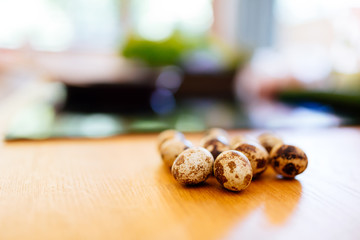 Naklejka na ściany i meble Healthy quail eggs on kitchen table
