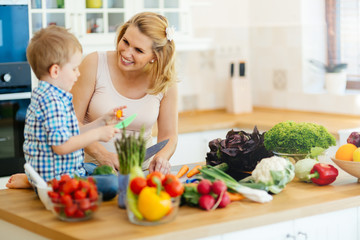 Mother and child preparing lunch