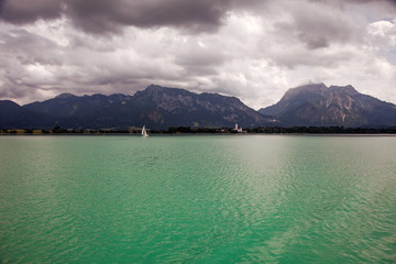 Boats and panoramic views of Forggensee lake, Germany