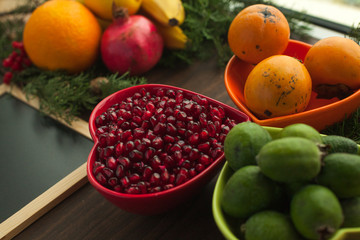 Naklejka na ściany i meble Bowl with purified pomegranate for making juice, healthy meal, ingredient for cooking. Fruit vitamins for healthy life.