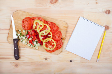 paper and vegetables on the table