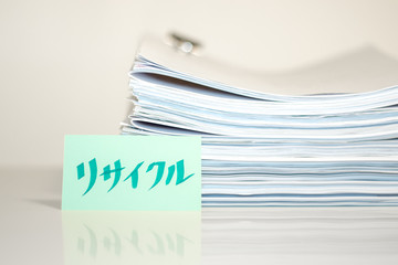 Recycle; Stack of Documents on white desk and Background.