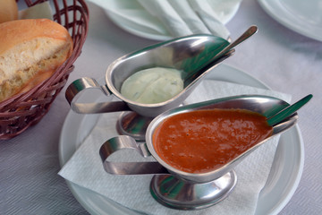 Pepper and alioli spanish sauce decorated on a restaurant table