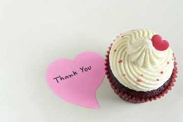 Cupcake with red heart and thank you massage