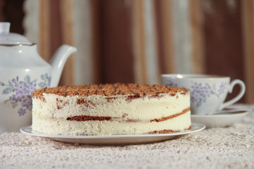 delicious cake on a plate and tea