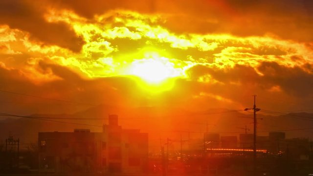 Daegu, Korea, Beautiful sunset with large clouds behind shining sun