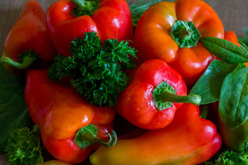 Red bell peppers with greens