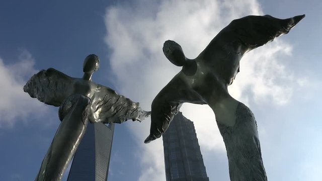 Time lapse angel statues in financial district Shanghai, China