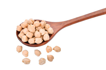 garbanzo beans in wooden spoon on white background