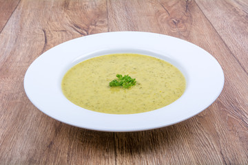 Cream of broccoli soup on a plate