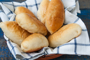 warm Russian pies with different fillings: meat, cabbage and apples. delicious with tea.