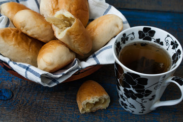 warm Russian pies with different fillings: meat, cabbage and apples. delicious with tea.