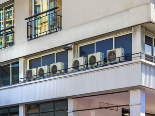 Obraz premium Small outdoor heater and air conditioner mounted on commercial building outdoor wall