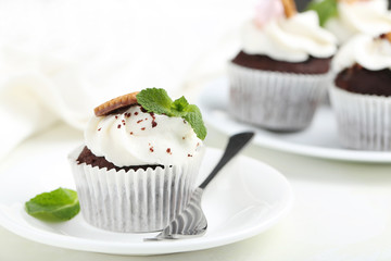 Chocolate cupcakes on a white wooden table