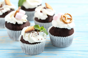 Chocolate cupcakes on a blue wooden table