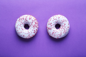 Sweet donuts on paper background