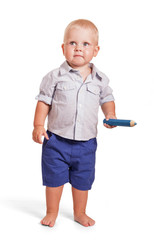 Charming boy standing and holding big pencil isolated on white.