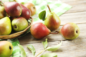Ripe pears on grey wooden table