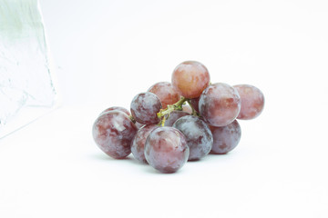 The big purple grapes on a white background.