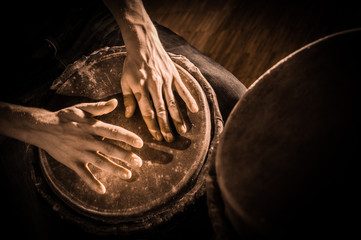 Fototapeta premium People hands playing music at djembe drums