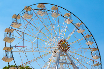 Ferris wheel in blue sky
