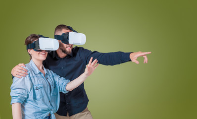 Excited young couple using a VR headset glasses