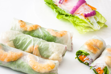 Vietnamese rolls with vegetables, rice noodles and prawns isolated on white background

