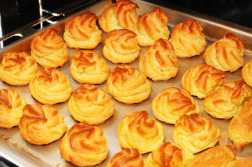 Profiteroles in the oven. Eclair. Homemade Cream Puffs.