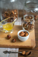 Assorted nuts: walnuts, almonds, hazelnuts and honey