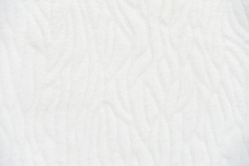 Fototapeta na wymiar Luxury Faux Fur in off white, white with interesting, unusual pattern. Concept and style for background, textures and wallpaper.