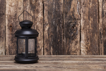 Christmas lantern on old wooden background