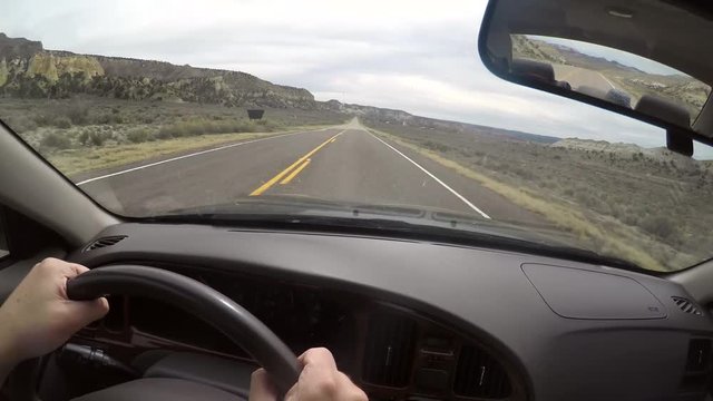 A timelapse of a man driving through desert road