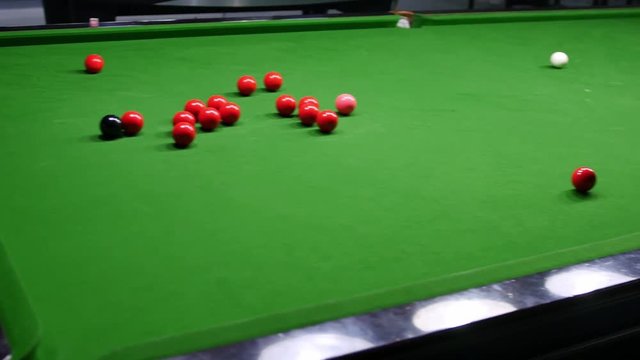 Footage Of A Peron Playing Snooker In An Entertainment Center...