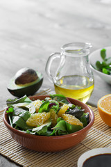 Fresh salad with avocado and orange