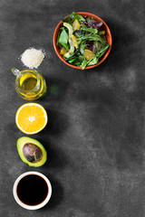 Obraz na płótnie Canvas Fresh salad with avocado and orange