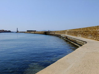 Obraz premium Lighthouse on the End of the Embankment in Chania City in Greece, Crete Island
