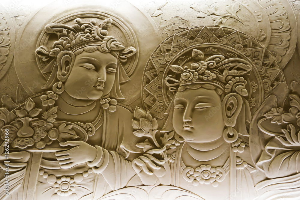 Wall mural stone bas -relief of buddha.