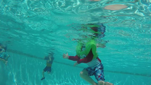 Underwater Shot Kids Swimming In An Outdoor Pool