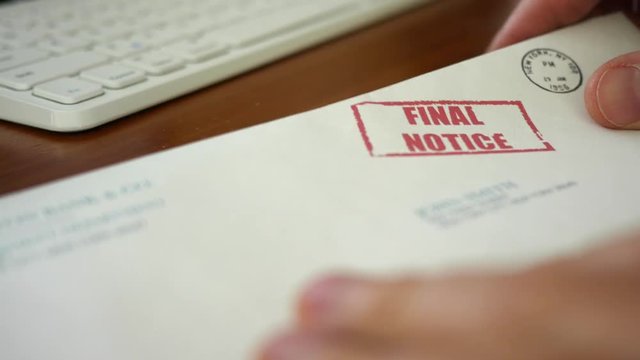 Man looking at final notice foreclosure letter from bank