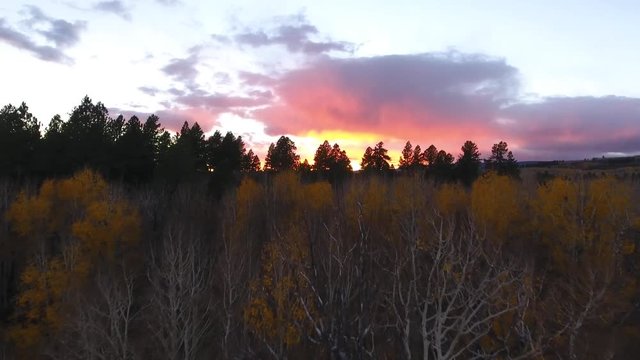 Aerial dolly shot beautiful mountain sunset and fall colors