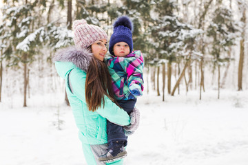 Fototapeta na wymiar Happy family. Mother and child girl on a winter walk in nature.