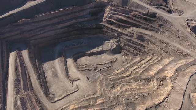 An aerial shot of large mining pit and industrial plant
