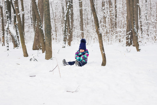 Baby girl playing in the snow