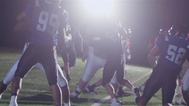 Football players react to a hand off