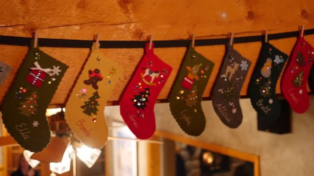 Stockings hang from mantle during family party